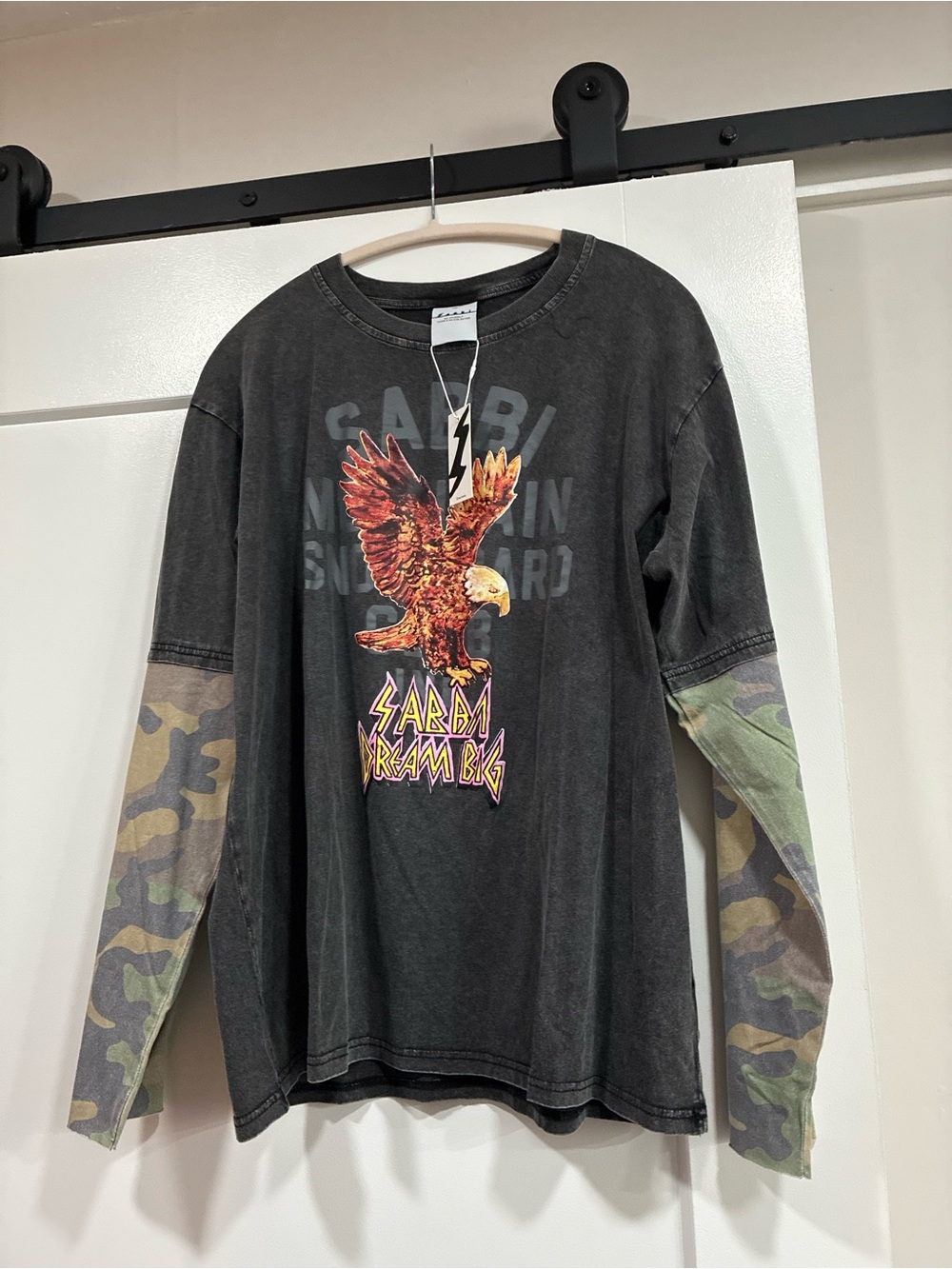 SABBI black long sleeve shirt with camo sleeves and eagle graphic.